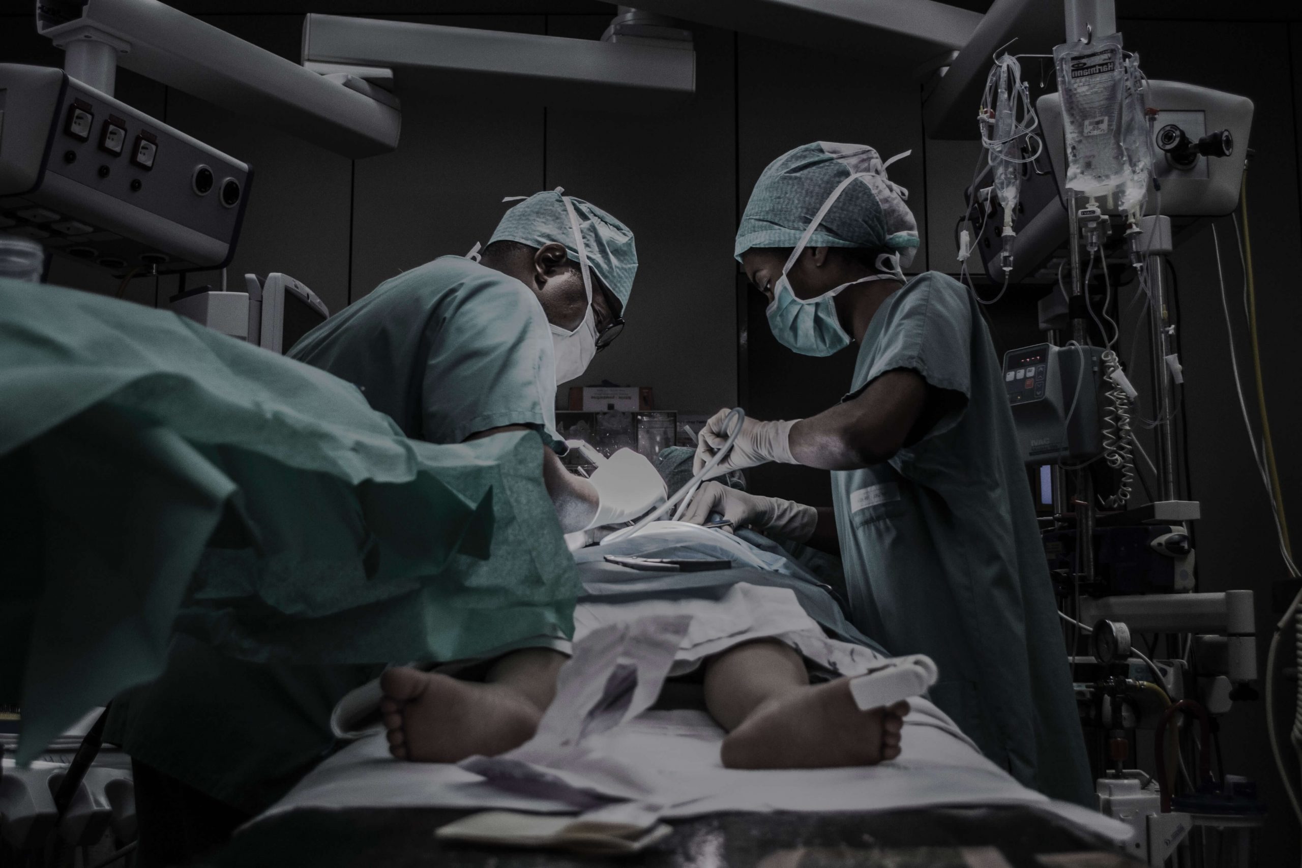 Surgical team at work in a well-equipped operating theatre